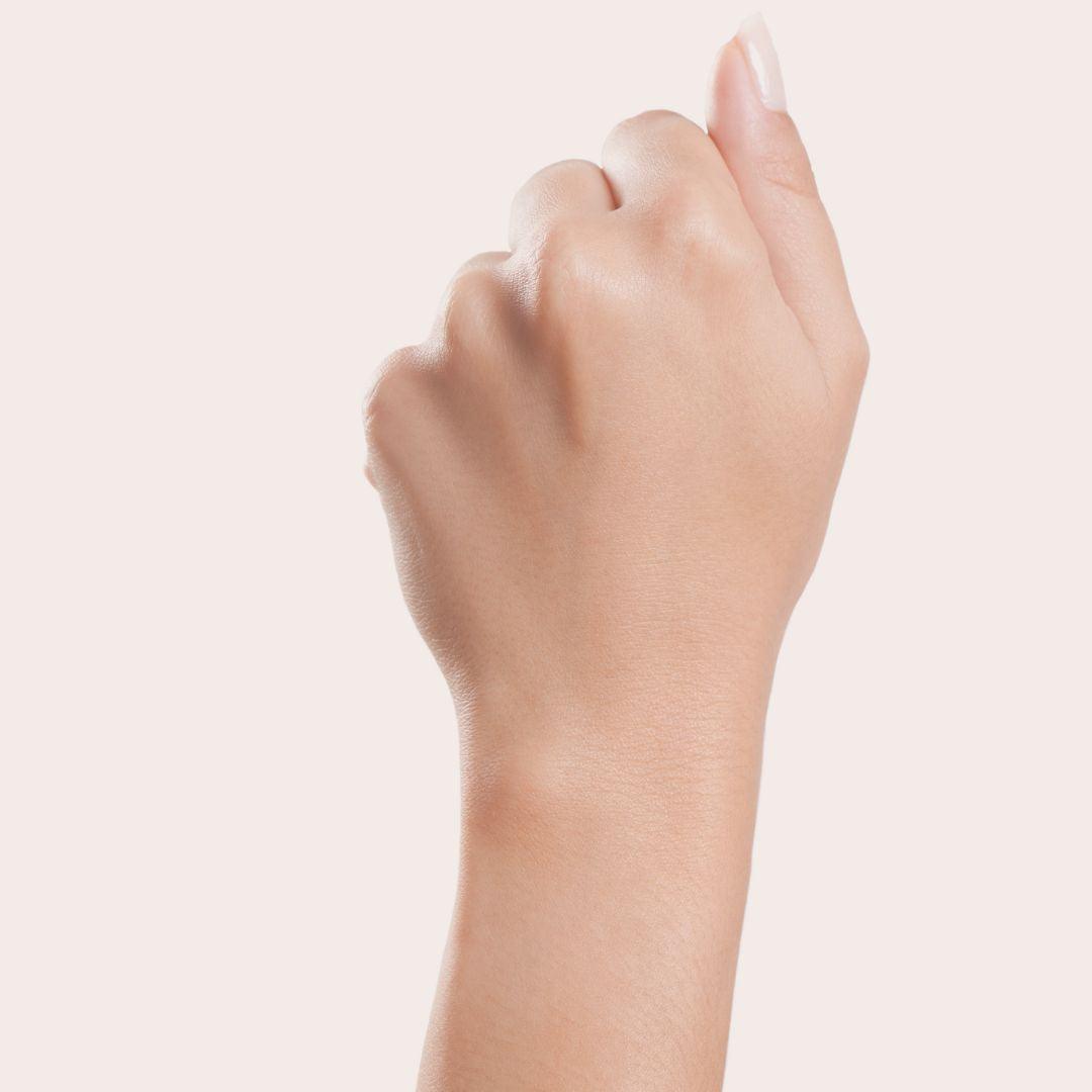 A woman with arthritis holds is doing the six pack hand exercises for arthritis