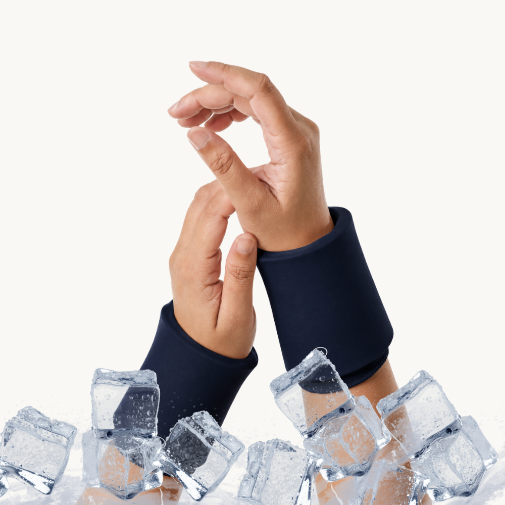 Two hands wearing midnight blue cooling compression sleeves for wrist positioned above clear ice cubes on a clean white background.