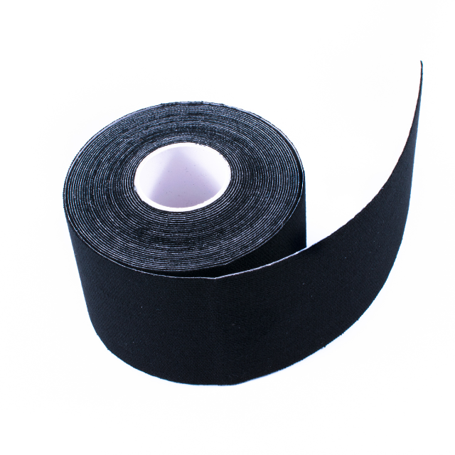 A roll of black kinesiology tape for arthritis placed on a white background.