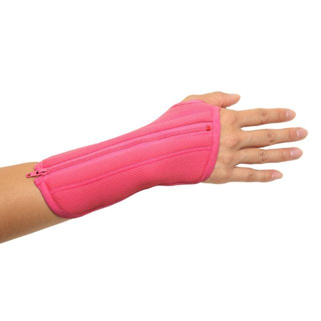 A hand wearing Bubblegum Pink wrist brace for carpal tunnel syndrome.