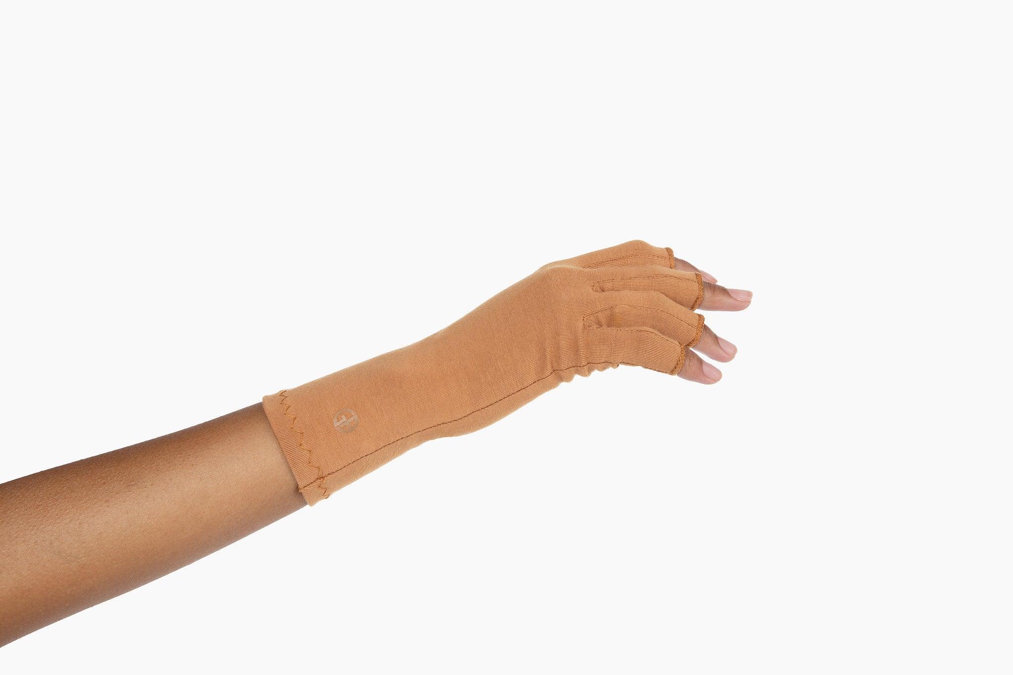 Cinnamon Brown Compression Gloves on a woman's hand palm facing downwards