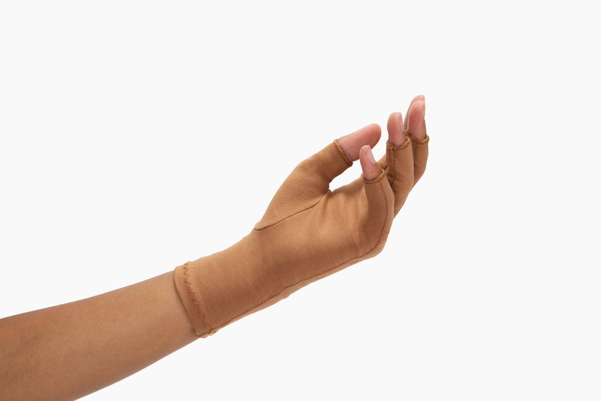 Cinnamon Brown Compression Gloves on a woman's hand slightly open palm facing upward