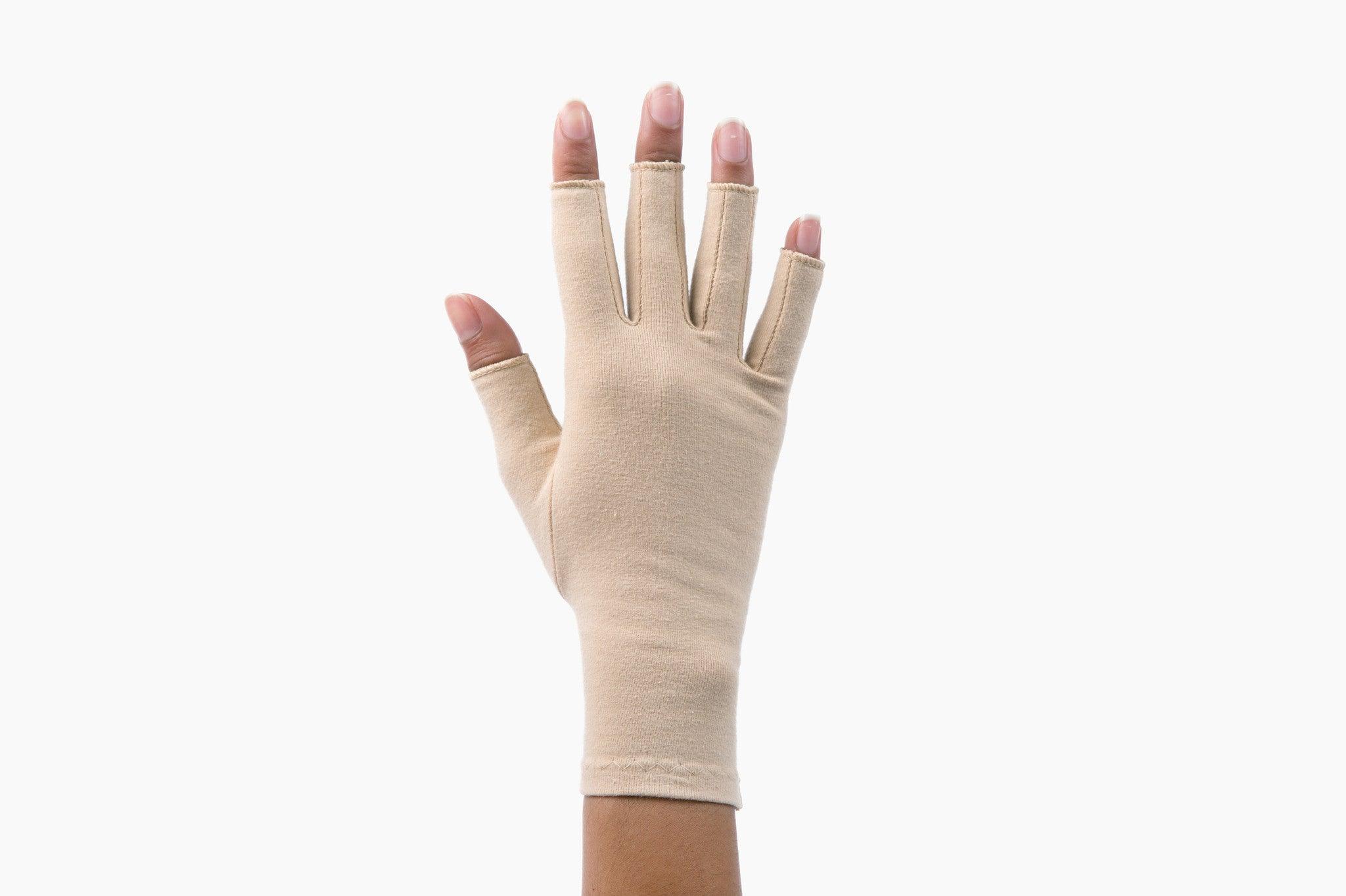 Sandy Beige Compression Gloves on a woman's hand showing the back of her hand