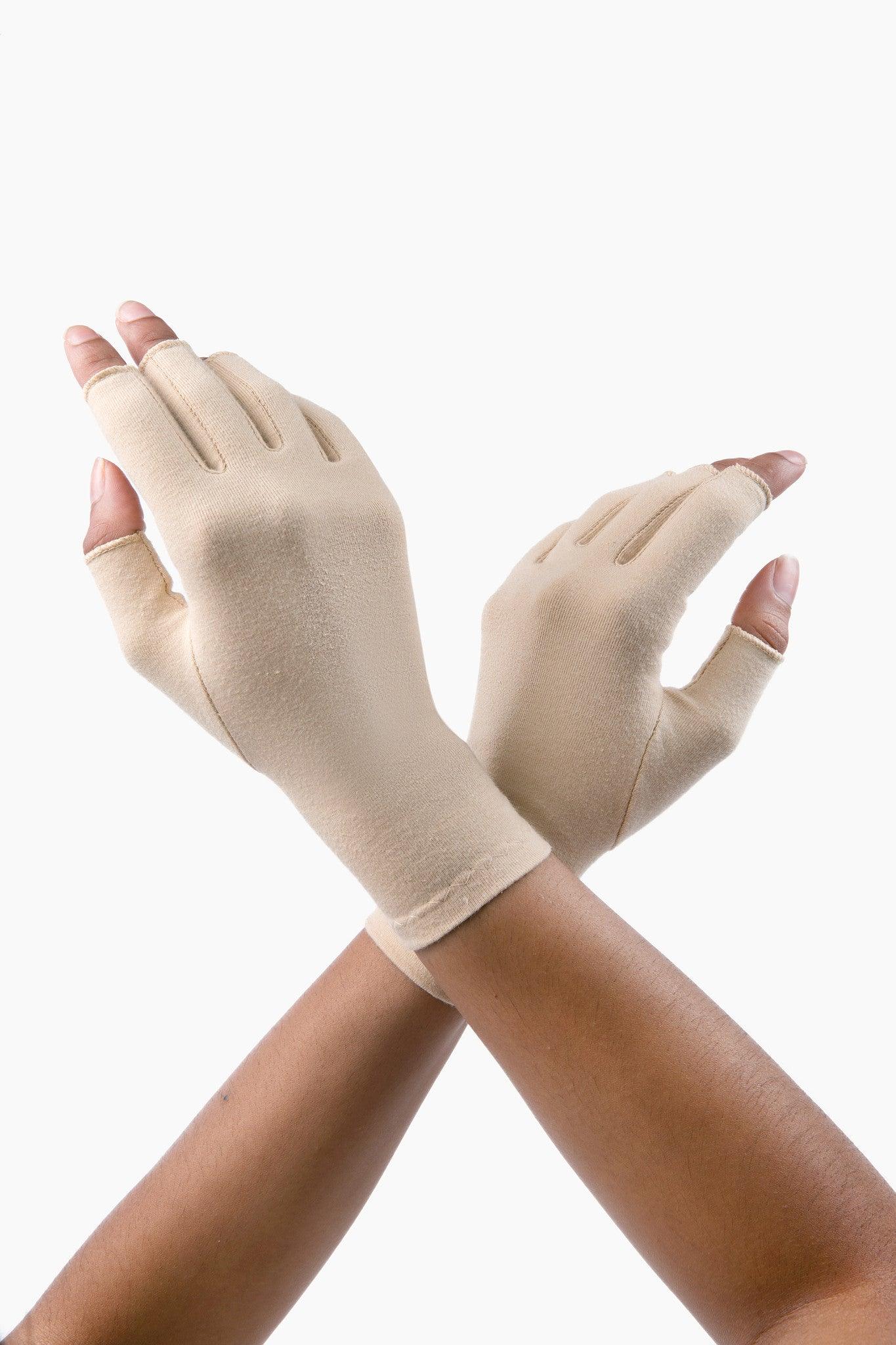 Sandy Beige Compression Gloves on a woman's hands crossed