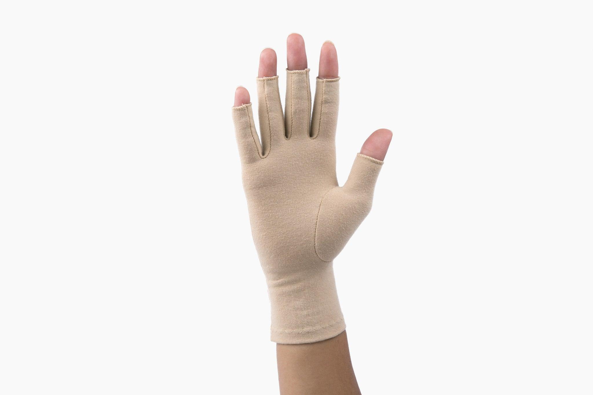 Sandy Beige Compression Gloves on a woman's hand showing the palm of her hand