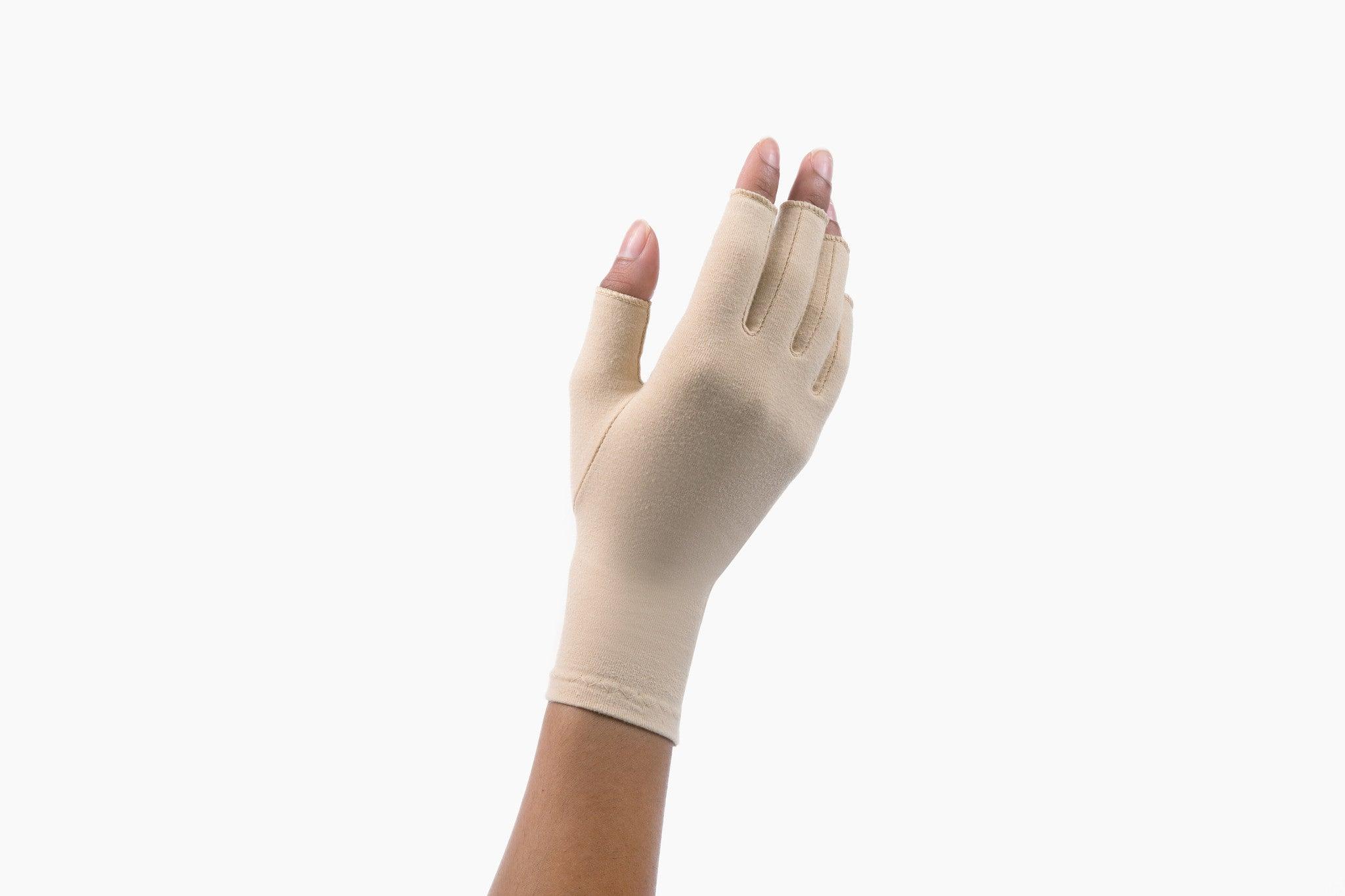 Sandy Beige Compression Gloves on a woman's hand slightly facing sideways