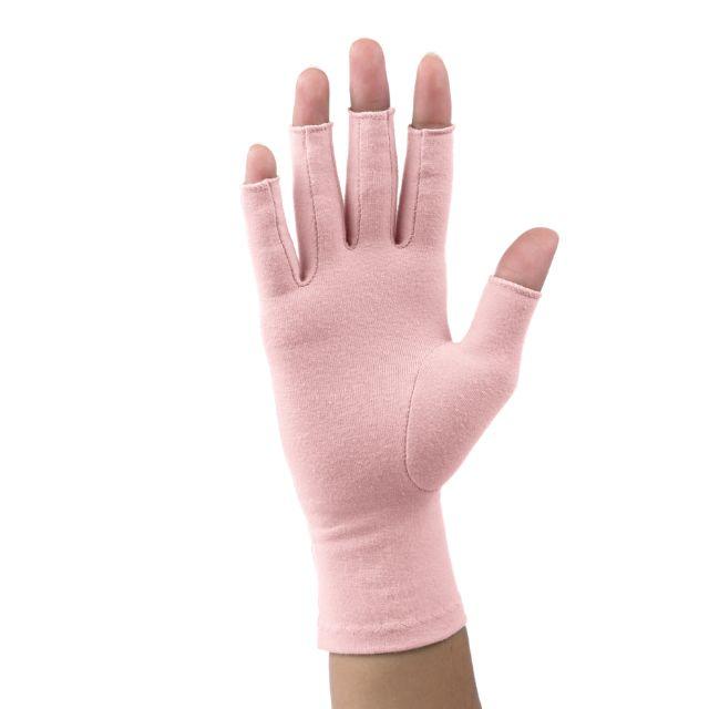 A tickled pink Compression Gloves worn by a woman with arthritis, her hands crossed with palms facing down on a white background.