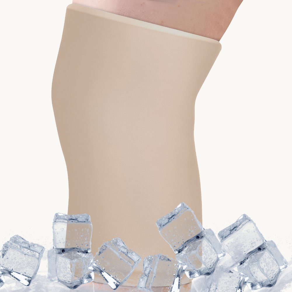 A latte beige cooling compression sleeve for knee, with ice cubes placed around the base against a white background.