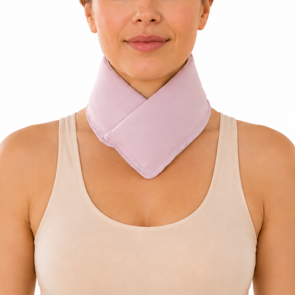 Woman wearing a pastel pink cooling neck wrap against a white background