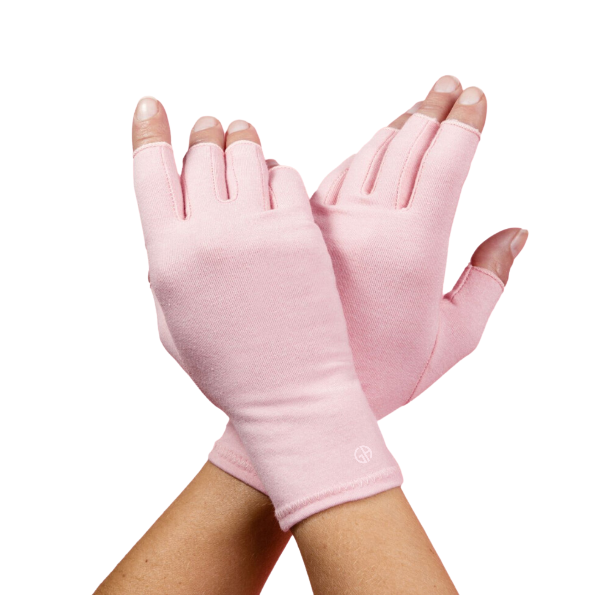 A pair of Ballet Pink Compression Gloves worn by a woman with arthritis, her hands crossed with palms facing down on a white background.