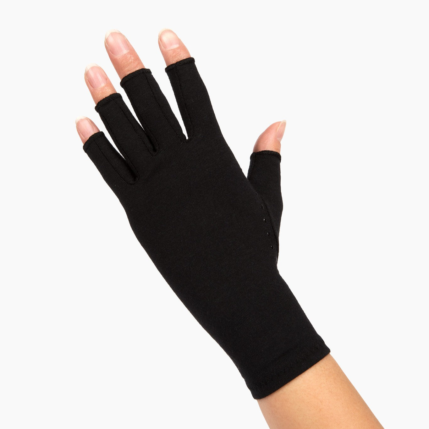 classic black compression gloves with silicone dots on palm worn by a hand with arthritis back of hand on a white background