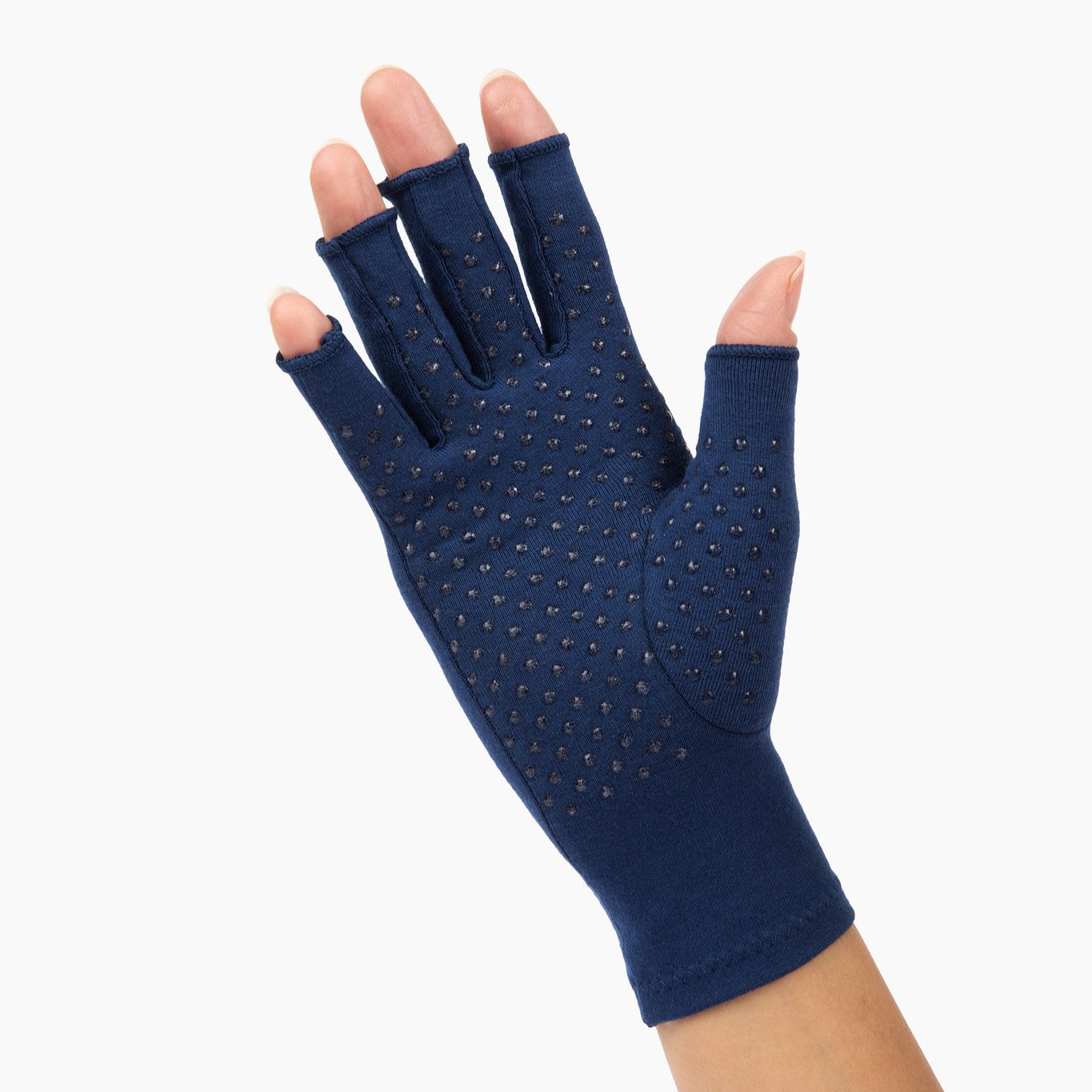 marine blue compression gloves with silicone dots on palm worn by a hand with arthritis waving on a white background