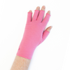 Load image into Gallery viewer, A close up of the hand of a woman with arthritis, wearing Coral Pink Compression Gloves and showing the back of her hand.