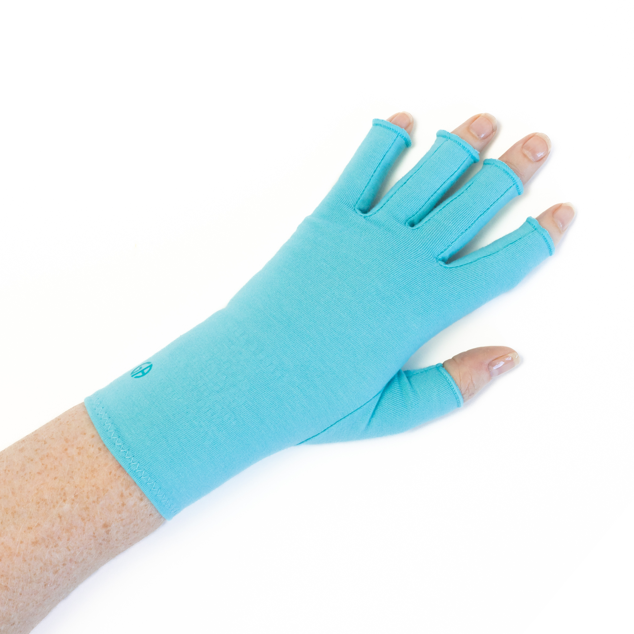 A close up of the hand of a woman with arthritis, wearing Aqua Blue Compression Gloves and showing the back of her hand.