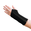  A woman with arthritis is showing her hand in close-up, wearing a Classic Black Wrist Brace with a zipper; the background is white.